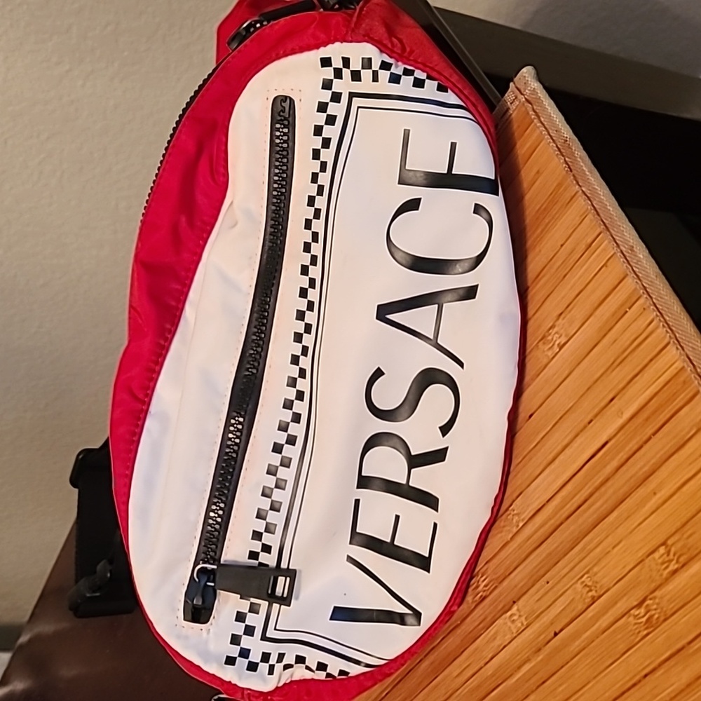 Versace traveling bag still have white outer bag for travel as well as card code